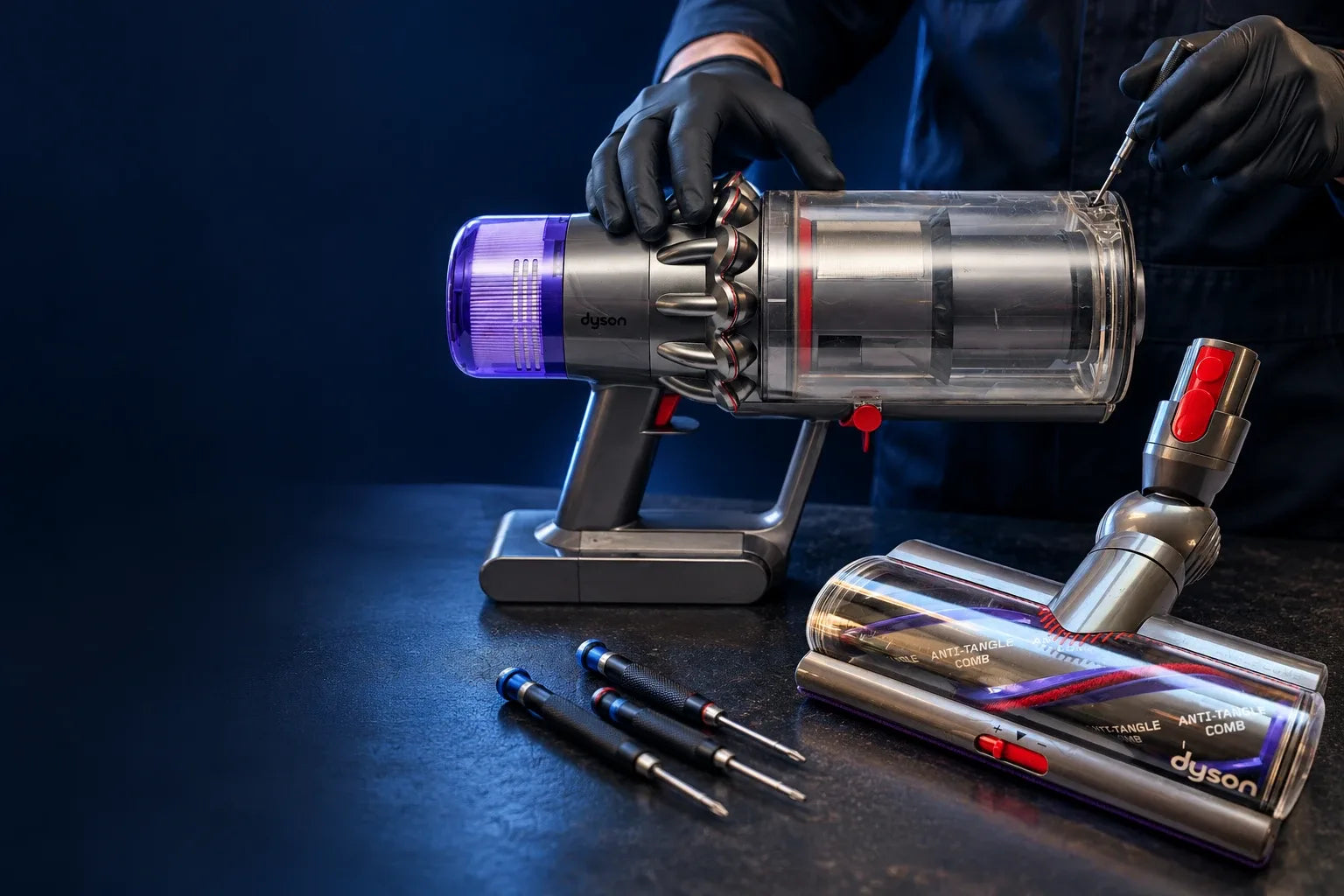 VacRevive technician servicing a cordless vacuum