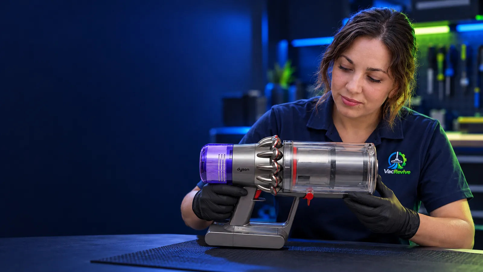 VacRevive founder inspecting a Dyson main body